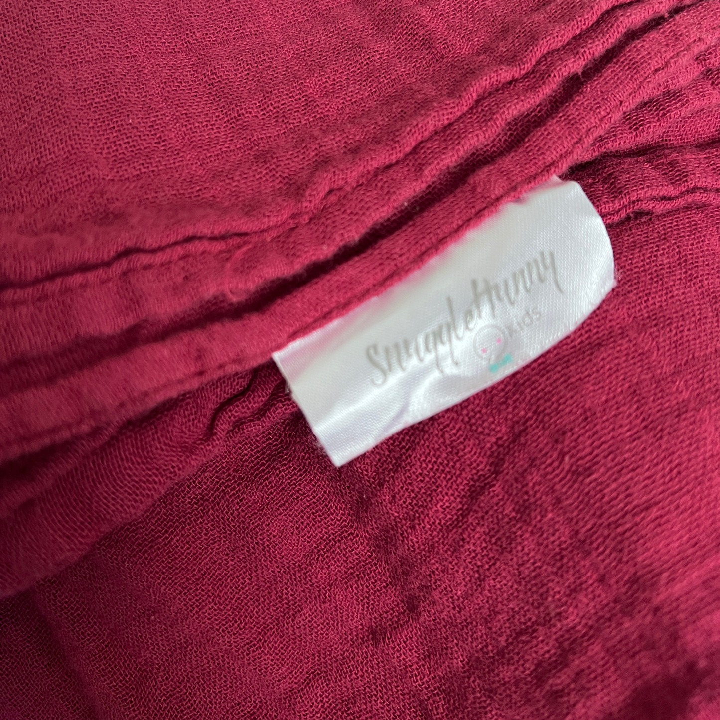Snuggle Hunny Organic muslin wrap in raspberry