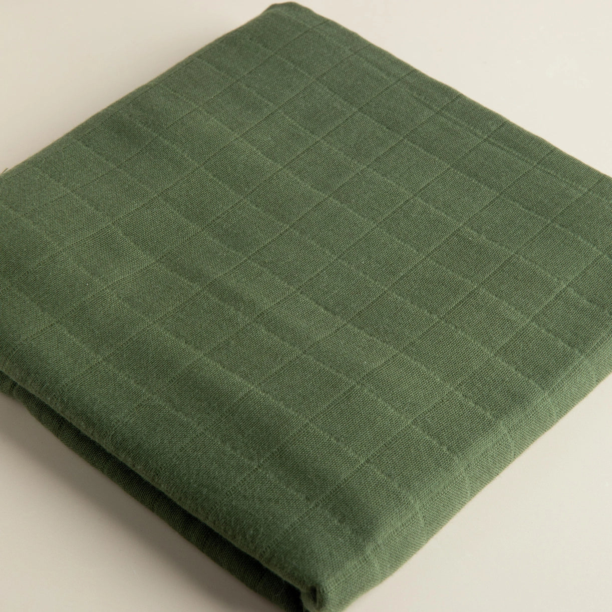 Snug as a Bub & Co olive muslin baby swaddle image 0